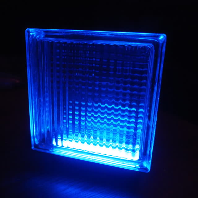 Close-up of the ridged glass glowing blue